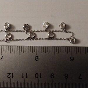 Sterling silver necklace w/ 15 cz's in 1/2" stations.